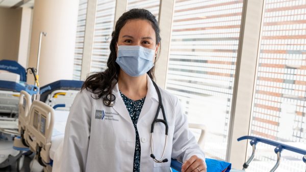 a female doctor wearing a surgical mask