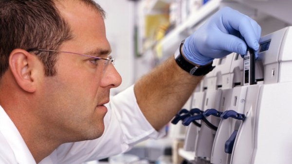Image of a male scientist working in a lab