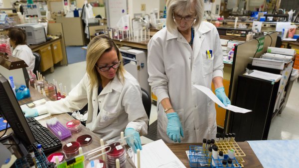 Image of two female scientists collaborating in a lab